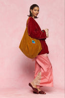 karavan loungewear planet fall winter 26' collection youreye bag orange gold