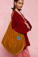 karavan loungewear planet fall winter 26' collection youreye bag orange gold