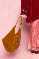 karavan loungewear planet fall winter 26' collection youreye bag orange gold