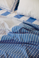 karavan clothing planet homeware collection spring summer 25 flat sheet four blues stripes