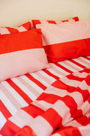 karavan clothing planet homeware collection spring summer 25 fitted sheet pink red stripes