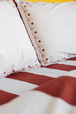 karavan clothing planet homeware collection fall winter 25 26 pillow case set hearts burgundy stripes