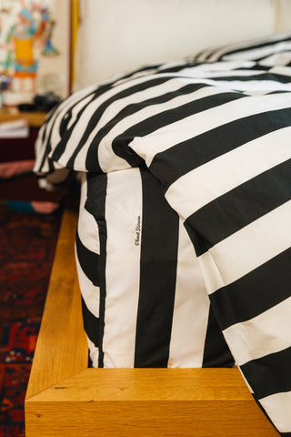 karavan clothing planet homeware collection fall winter 25 26 fitted sheet black white stripes