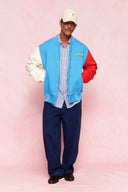 karavan men fall winter 26' collection leandro varsity jacket light blue ivory red