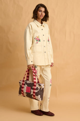 karavan clothing fashion fall winter 25 homecoming collection alexia handbag cow stripes