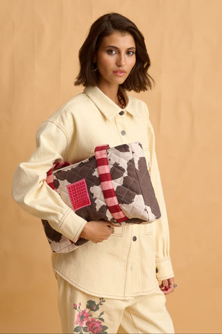 karavan clothing fashion fall winter 25 homecoming collection alexia handbag cow stripes