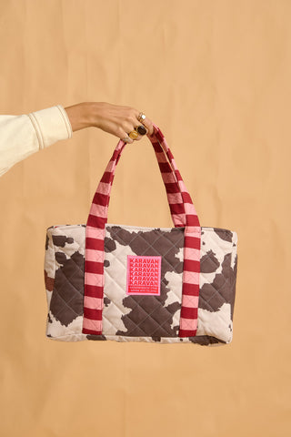 karavan clothing fashion fall winter 25 homecoming collection alexia handbag cow stripes