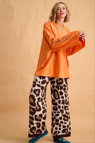 karavan clothing fashion fall winter 25 homecoming collection jutte longsleeve orange