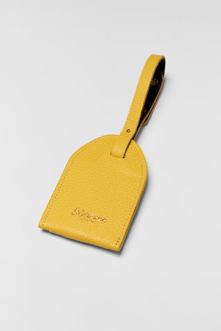 karavan clothing fashion spring summer 26 nai collection luggage tag yellow leather