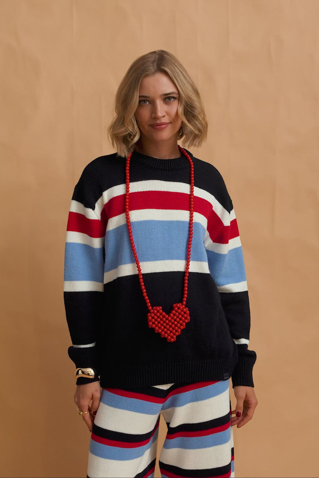 karavan clothing fashion fall winter 25 homecoming krvn collection nivia knitted sweater blue red stripes